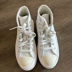 White leather platform high top converse. Some scuffing on toe and heels.
